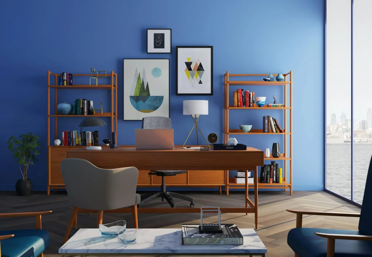 Image of a desk in a sunny room near a blue wall